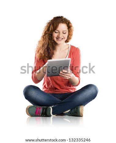 Beautiful girl with tablet is isolated on white background
