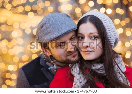 Romantic portrait of young couple in winter town