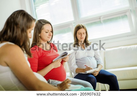 Happy pregnant women meeting at antenatal class in the hospital