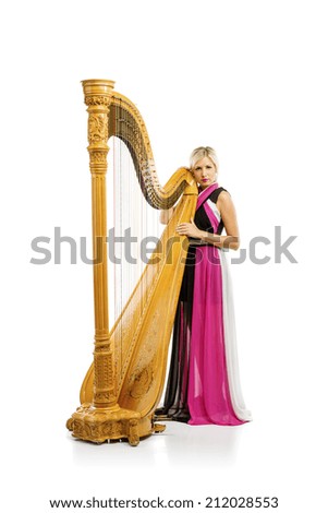 Elegant woman in purple dress playing the harp, isolated on white background