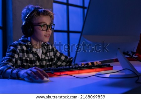 Similar – Image, Stock Photo Concentrated boy playing video game