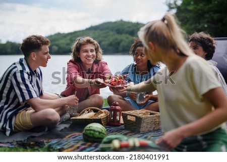 Similar – Image, Stock Photo Traveling couple near lake in forest