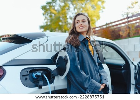 Similar – Image, Stock Photo woman charging batteries in the middle of nature