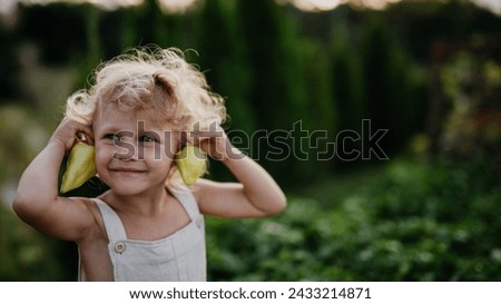 Similar – Image, Stock Photo Child holding green pepper