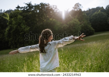Similar – Image, Stock Photo Playful girl standing in pier near lake