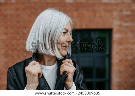 Similar – Image, Stock Photo mature woman with grey hair using tarot cards to predict future