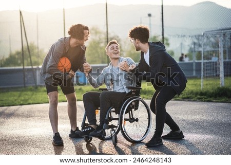 Similar – Image, Stock Photo Young man playing basketball on outdoor court.