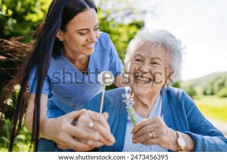 Image, Stock Photo Woman in wheelchair with her dog outdoors