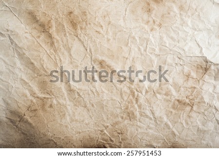 Piece of old rumpled stained paper as background