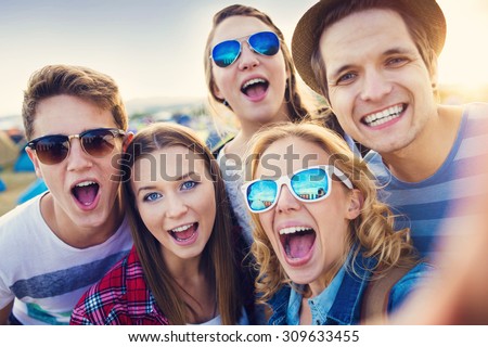 Group of beautiful teens at summer festival