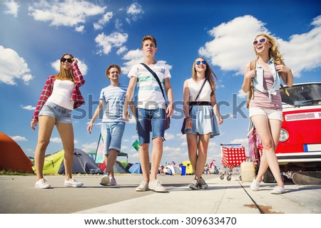 Group of beautiful teens at summer festival