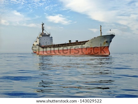 large cargo ship at sea  background of blue sky in the calm
