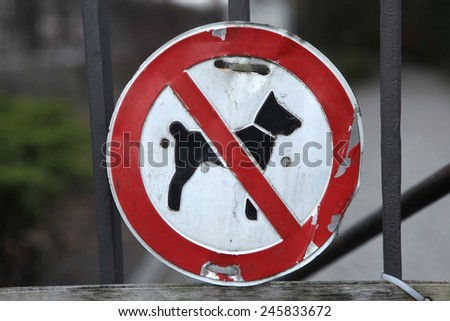 No Dogs Allowed! Old prohibition sign on the entrance gate in Berlin, Germany.