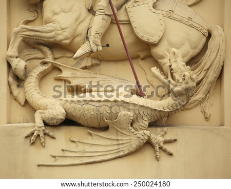Dragon killed by Saint George. Stucco decoration on the Art Nouveau building in Prague, Czech Republic.