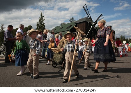 BURG, GERMANY - AUGUST 28, 2011: People attend the Sorbian harvest festival in the Lusatian village of Burg in Spreewald Region, Lower Lusatia, Brandenburg, Germany.