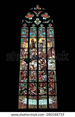 KUTNA HORA, CZECH REPUBLIC - AUGUST 24, 2014: The Holy Family, an Art Nouveau stained glass window in Saint Barbara Church in Kutna Hora, Czech Republic.