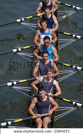 Junior rowing team rowing ahead during a boat-race on the River Vltava in Prague, Czech Republic