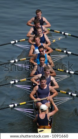 Junior rowing team rowing ahead during a boat-race on the River Vltava in Prague, Czech Republic.