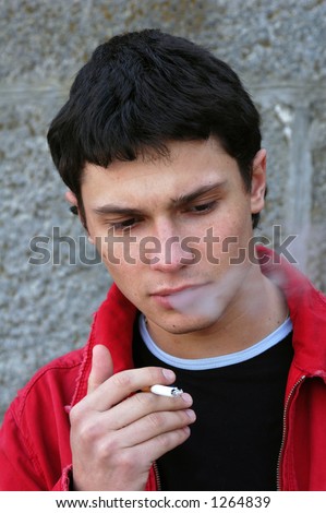 Young Male Model Smoking A Cigarette Stock Photo 1264839 : Shutterstock