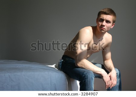 Shirtless Sexy Young Men Sitting On The Bed In The Bedroom Stock Photo ...