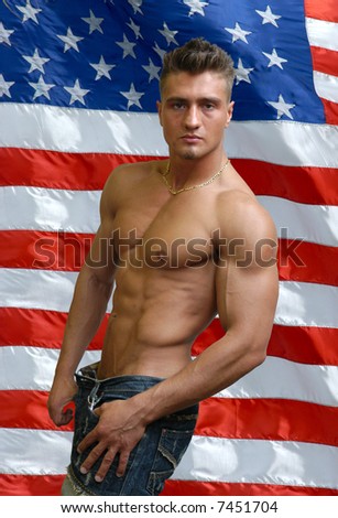 Muscular sexy man with US flag behind