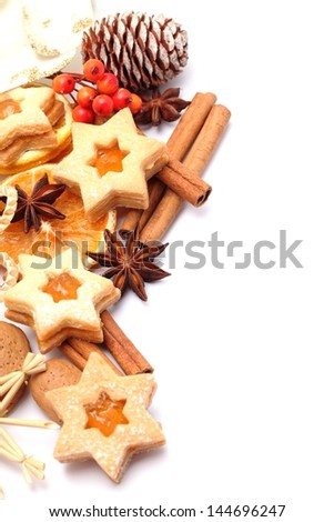Dry orange slices, spices and Christmas cookies on white background with copy space.