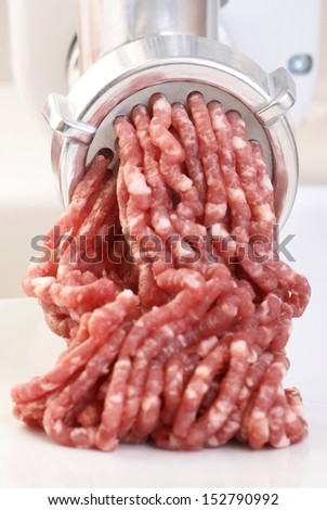 Close-up of mincer and ground meat