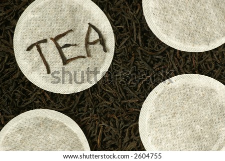 Close-up of natural black tea and round tea bags