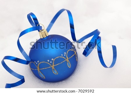 Blue ornament on the snow