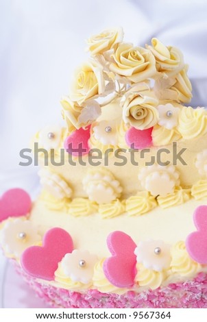 Detail of wedding or valentine cake with pink hearts
