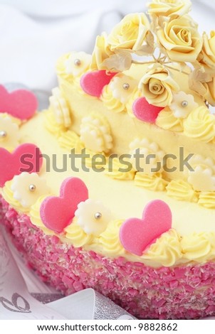 Detail of wedding cake with pink hearts