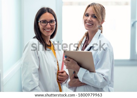 Similar – Image, Stock Photo two pretty women looking phones in bar while drinking coke and coffee