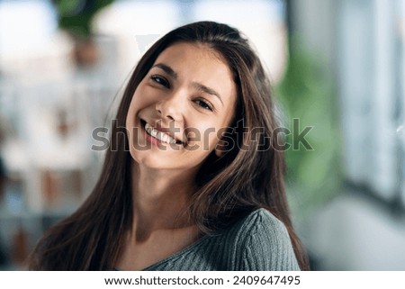 Similar – Image, Stock Photo A young girl is sitting in a chair and exchanging messages online on her phone. Home recreation, modern lifestyle