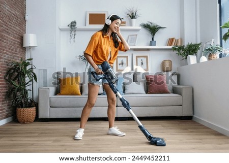 Similar – Image, Stock Photo Young woman listening to music from vinyl record player. Playing music on turntable player. Female enjoying music from old record collection at home