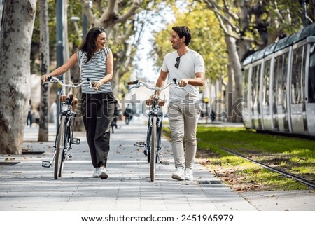 Similar – Image, Stock Photo Active sporty couple riding mountain bikes on demanding forest trail.