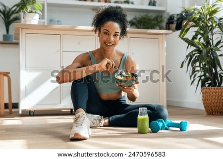 Similar – Image, Stock Photo Athletic woman in the gym lifting weights in the gym