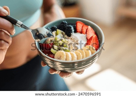 Similar – Foto Bild Leckere Frühstücksschüssel mit Quinoa, Reis und Grütze in der Nähe von Teetasse und Zeitung