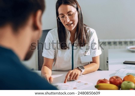 Similar – Image, Stock Photo Fitness woman consulting her training on her smartphone sitting in a jump box in the gym