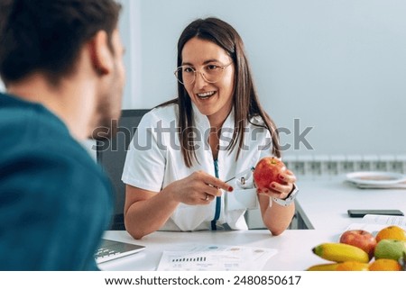 Similar – Image, Stock Photo Fitness woman consulting her training on her smartphone sitting in a jump box in the gym