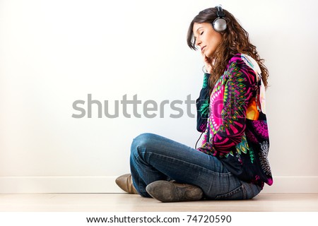 Beautiful young woman listen music