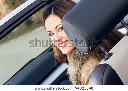beautiful woman traveling in a convertible car Foto stock © 