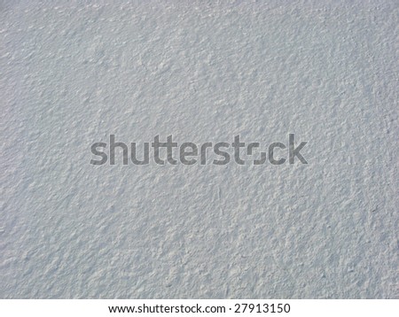 Textured snow from above. Overhead low-level aerial shot of snow on a beach near the Ottawa River shoreline at Westboro Beach in January. Kite Aerial Photography.