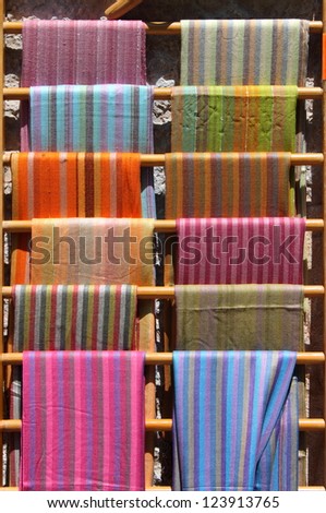 Colorful scarves stacked in a fashion shop