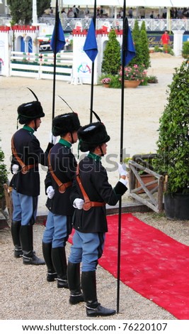 ROME - MAY 29: Three guards at attention during the prize giving ceremony at horses tournament of Piazza di Siena 2010 on May 29, 2010 in Rome, Italy