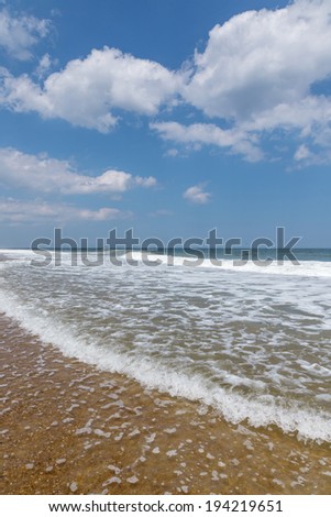 Wide angle view of foaming surf along the Atlantic coast