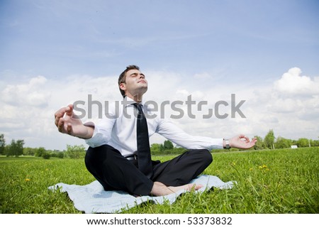businessman outdoor do yoga exercise