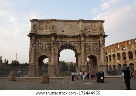 ROME, Italy - SEPTEMBER 27: Arch of Constantine on September 27, 2011 in Rome Italy. Crowds of tourists visiting the Arch of Constantine and Colosseum - major touristic attraction in Rome