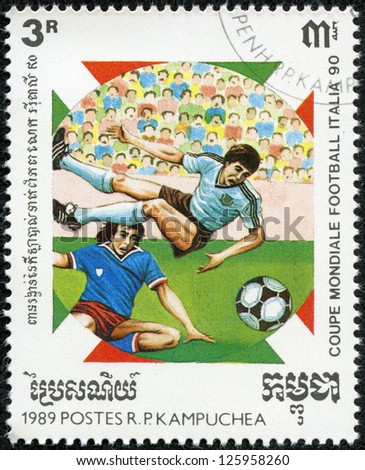 CAMBODIA - CIRCA 1989: a stamp printed by Cambodia shows football players. World football cup in Italy 1990, series, circa 1989