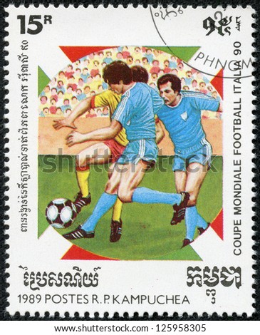 CAMBODIA - CIRCA 1989: a stamp printed by Cambodia shows football players. World football cup in Italy 1990, series, circa 1989