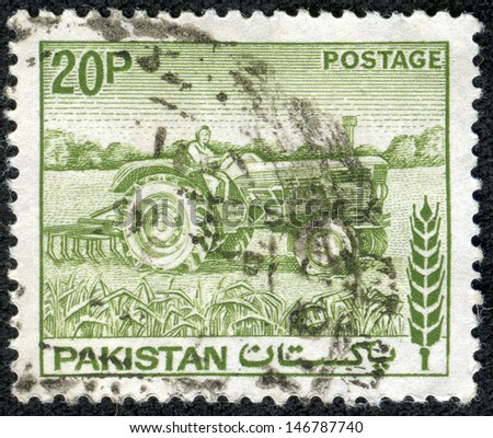 PAKISTAN - CIRCA 1970: A stamp printed in Pakistan shows woman tractor driver , circa 1970